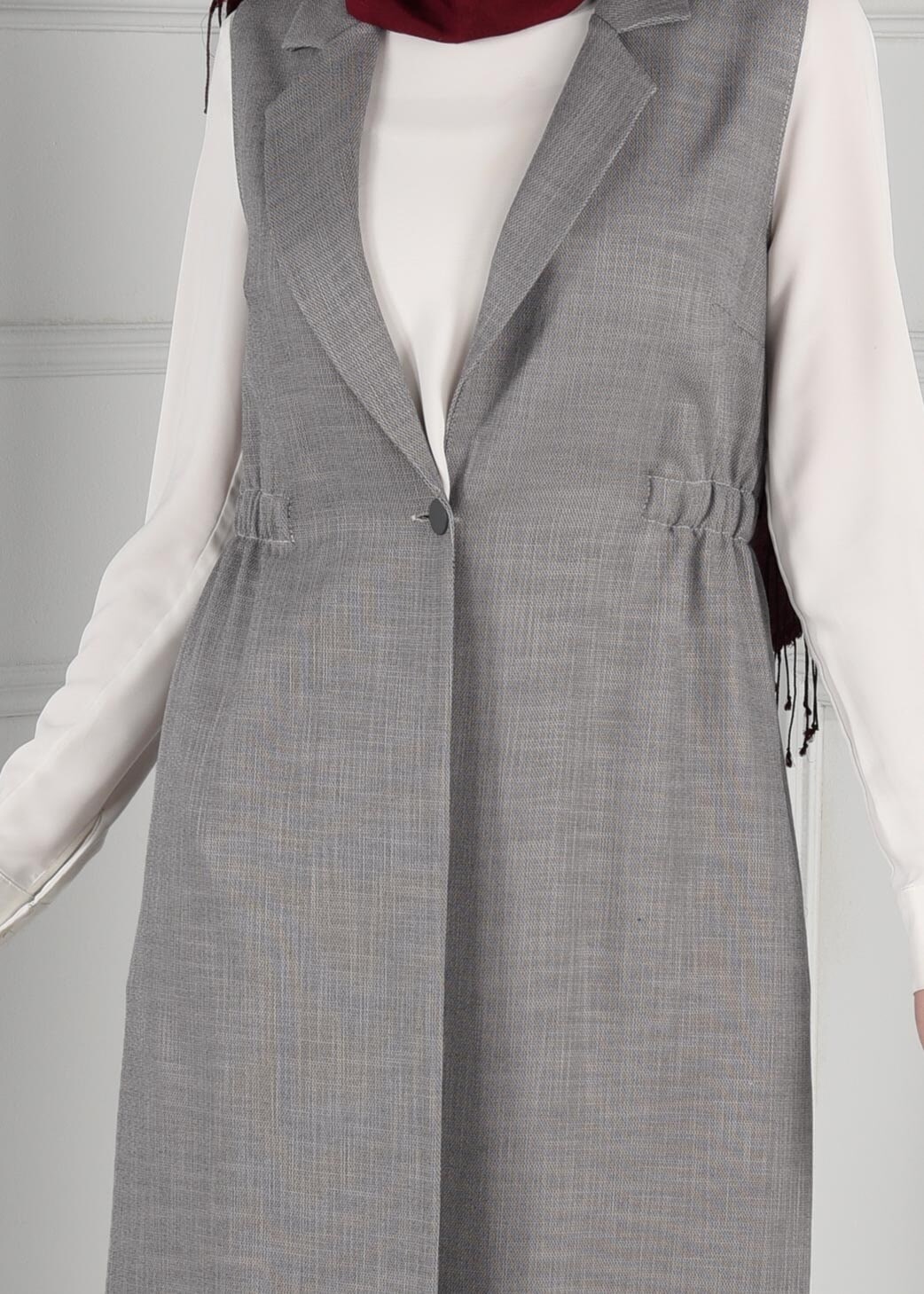 Tesettür giyim GRİ BELİ LASTİKLİ SIRTI NAKIŞ İŞLEMELİ DÜĞMELİ YELEK 4749