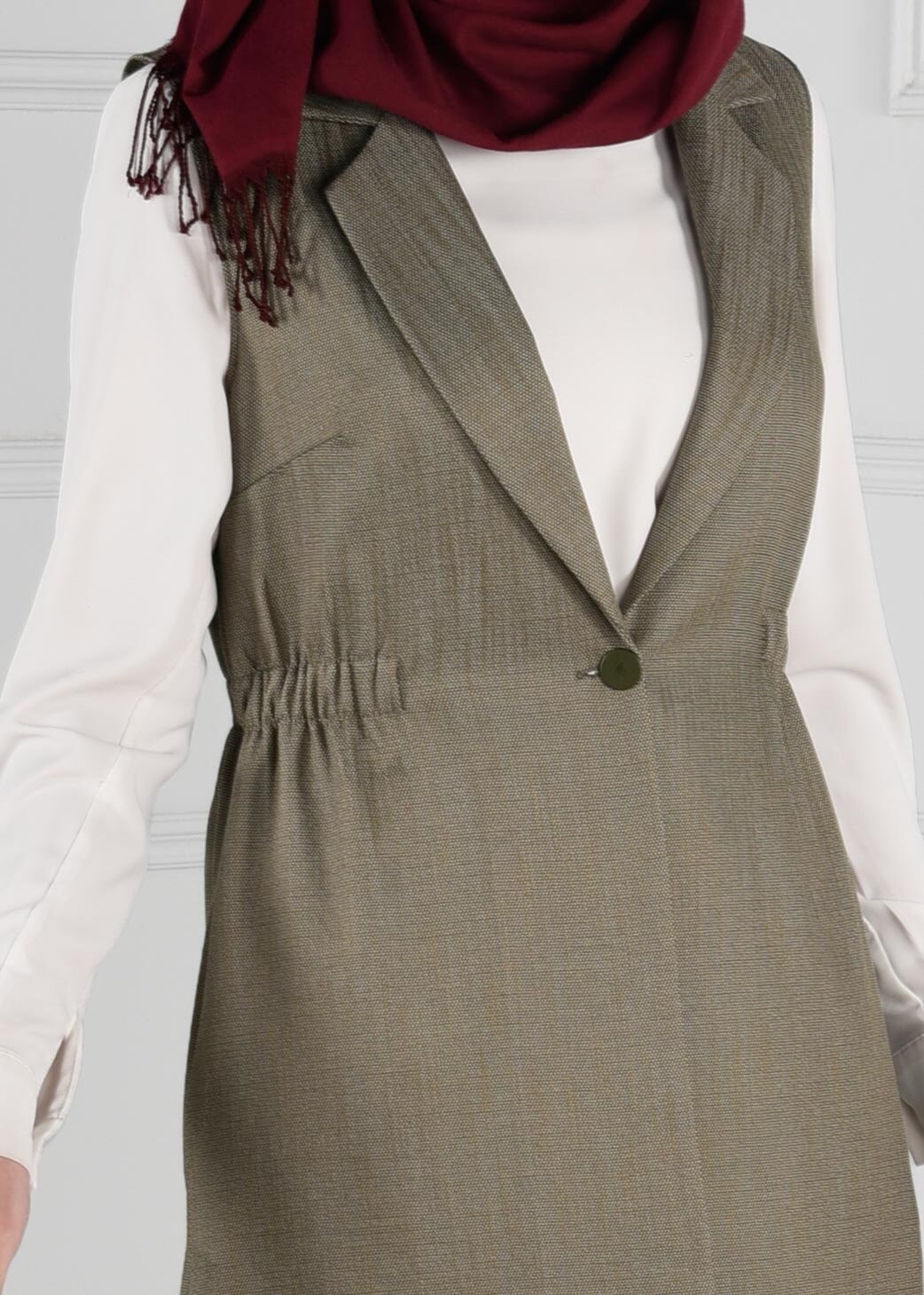 Tesettür giyim HAKİ BELİ LASTİKLİ SIRTI NAKIŞ İŞLEMELİ DÜĞMELİ YELEK 4749