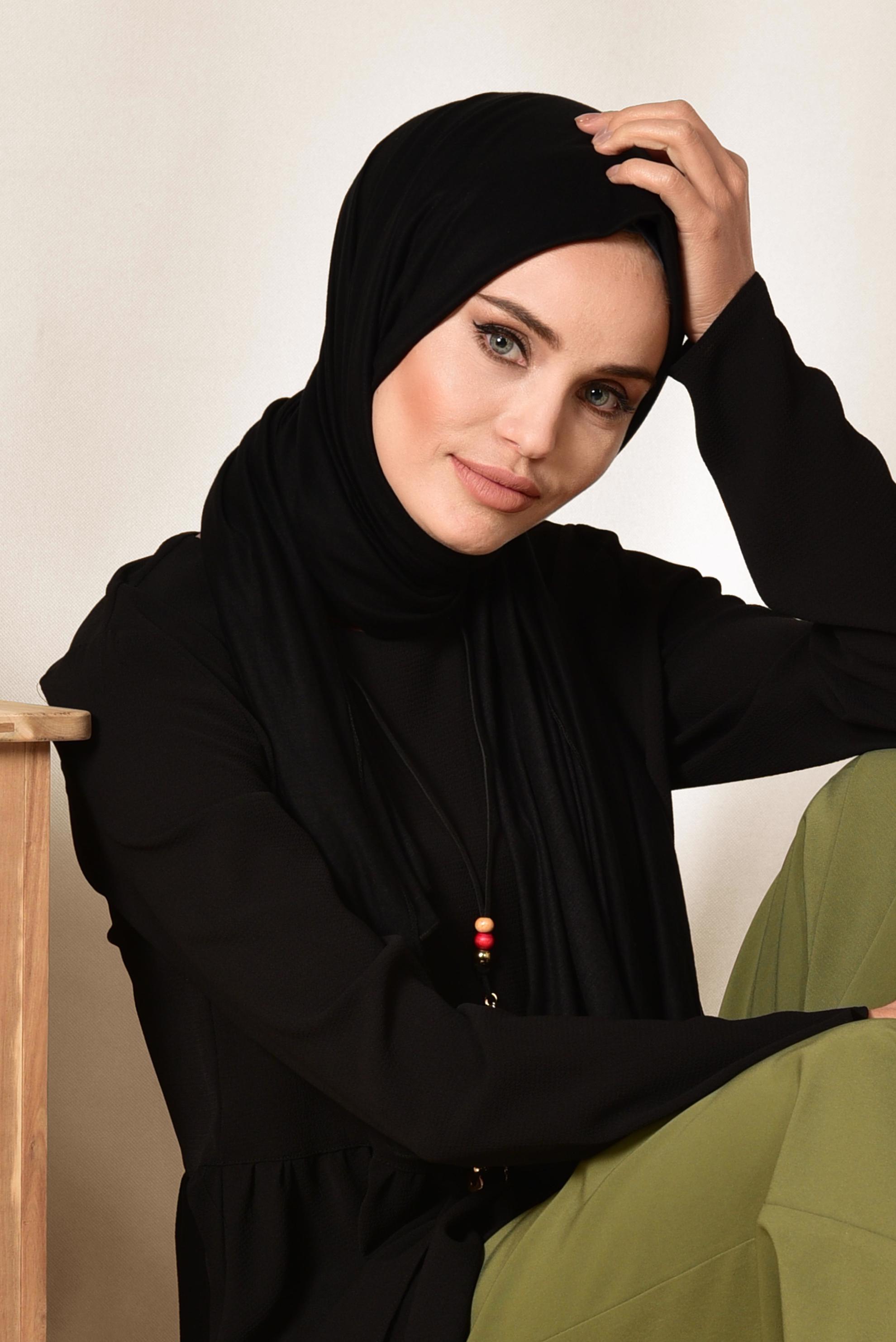 Tesettür giyim SİYAH ASİMETRİK KESİM VOLANLI TUNİK 4864