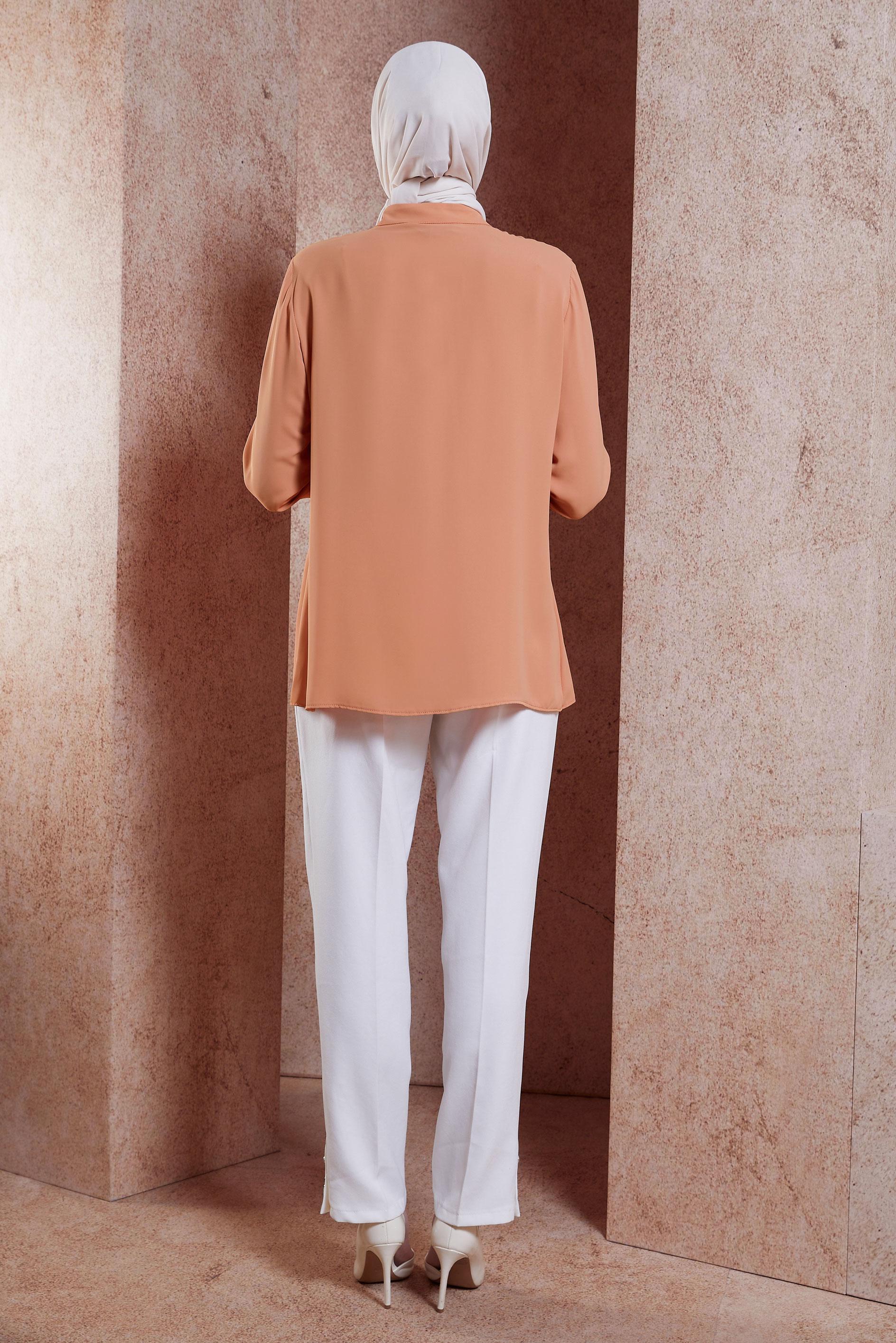 Tesettür giyim PEMBE VOLAN DETAYLI ÇİÇEK AKSESUARLI BLUZ 42794