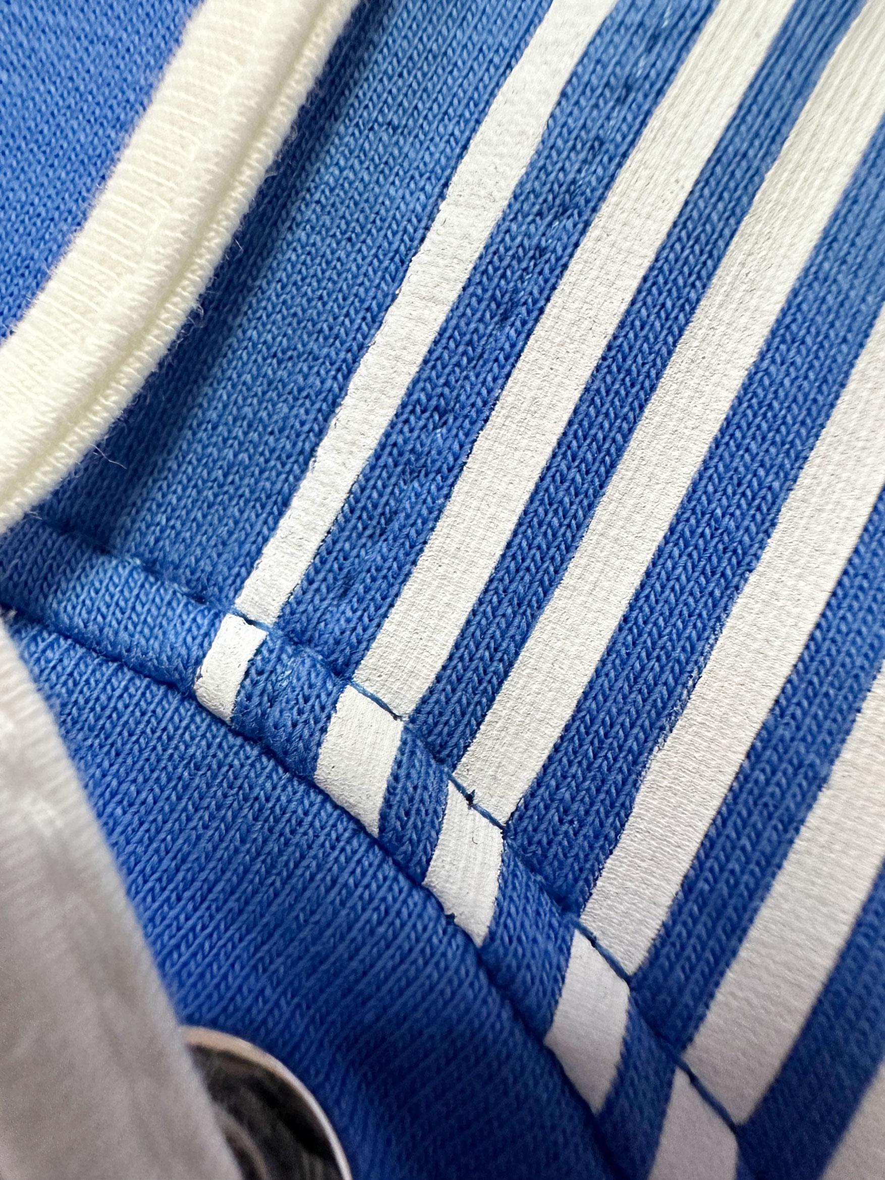 Tesettür giyim MAVİ ÇİZGİ DETAYLI YAKASI BÜZGÜLÜ EŞOFMAN TUNİK 43785